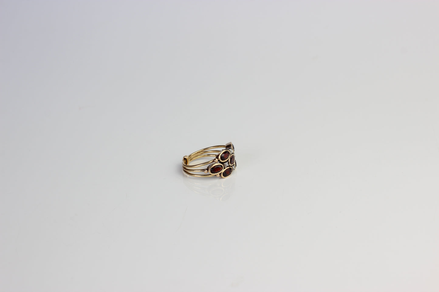 Mystical "Harem" Ring in 19 Carats Gold, Diamonds, and Fire Garnets