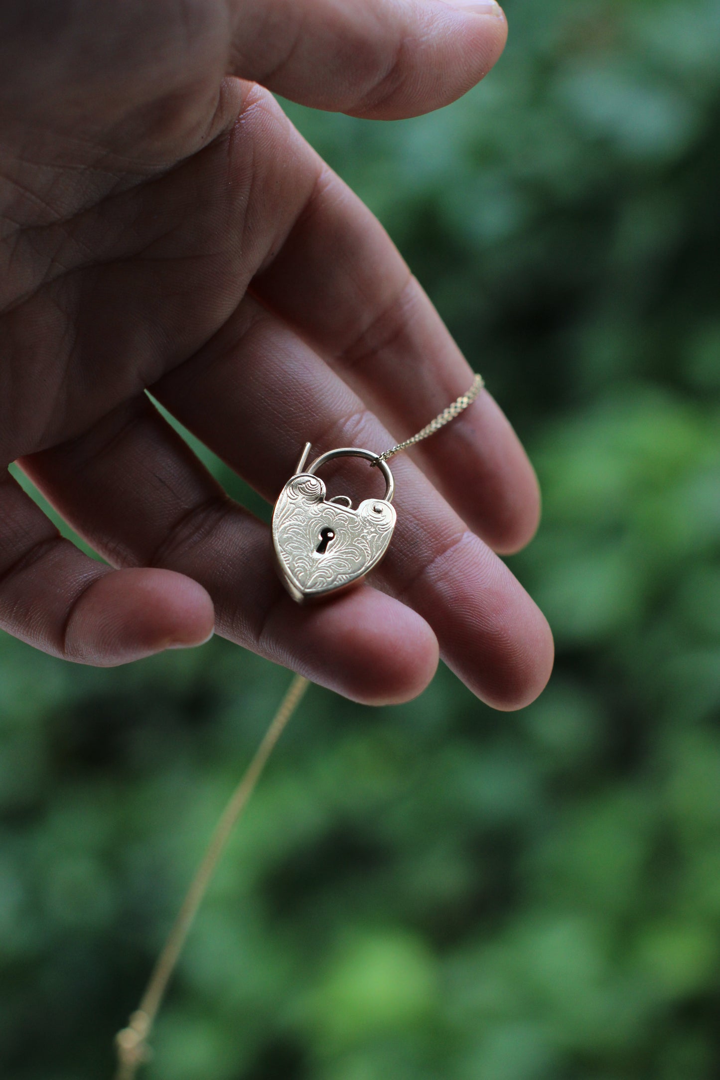Early 1900s English 9k Gold Heart Lock Pendant with Arabesque Engravings