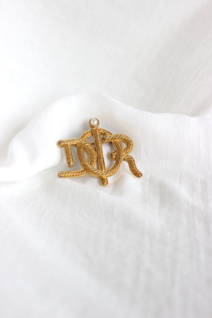 Broche symbole tressée en corde de bateau Dior des années 1980