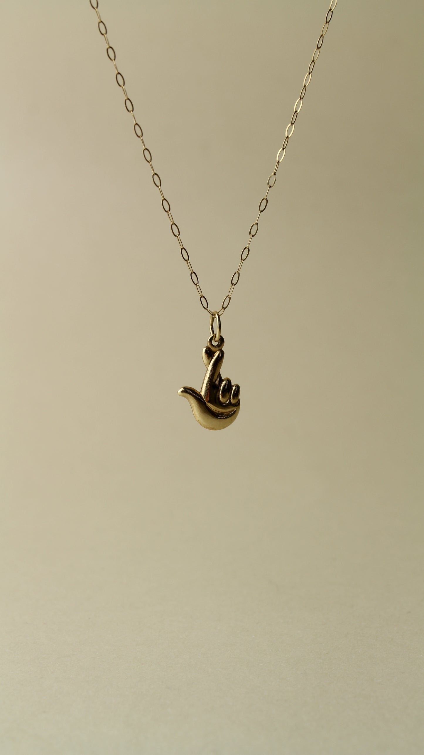 Rare 90's necklace from the Official National Lottery England, featuring the iconic “lucky hand” symbol!