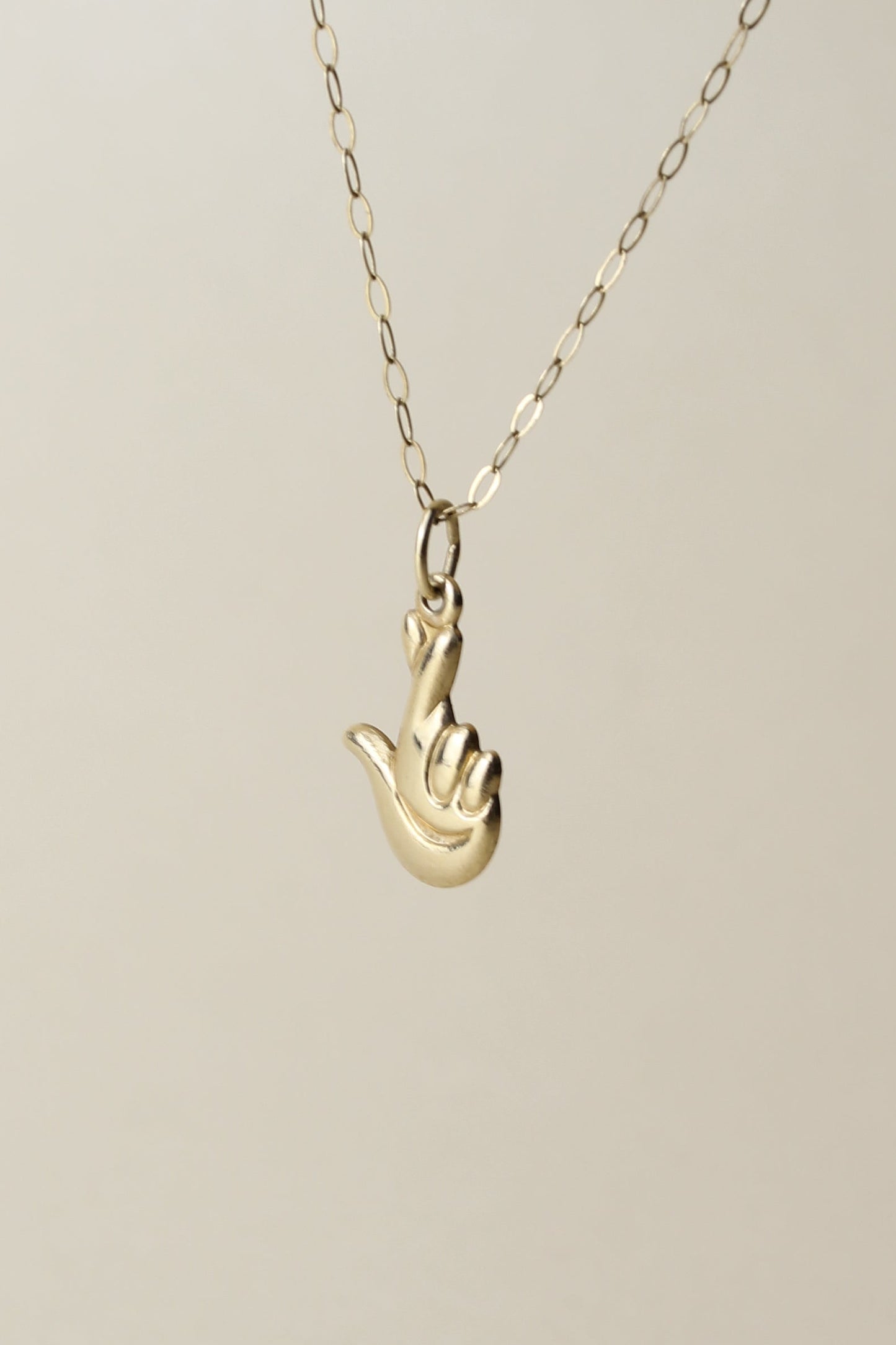 Rare 90's necklace from the Official National Lottery England, featuring the iconic “lucky hand” symbol!