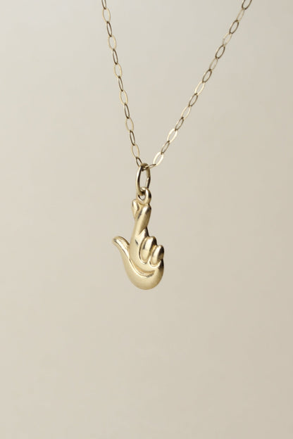 Rare 90's necklace from the Official National Lottery England, featuring the iconic “lucky hand” symbol!