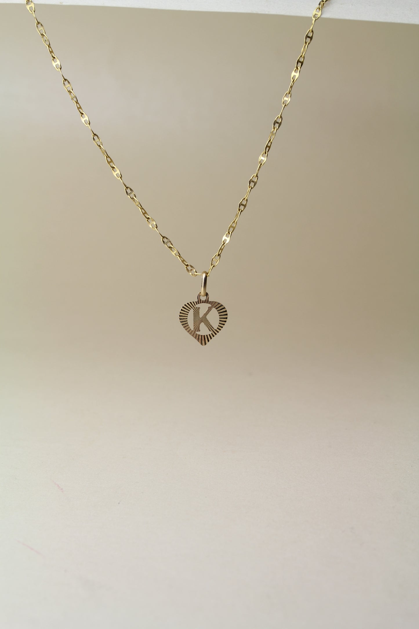 9k Yellow Gold Pendant – Letter "K" in a Heart – Reflective Finish