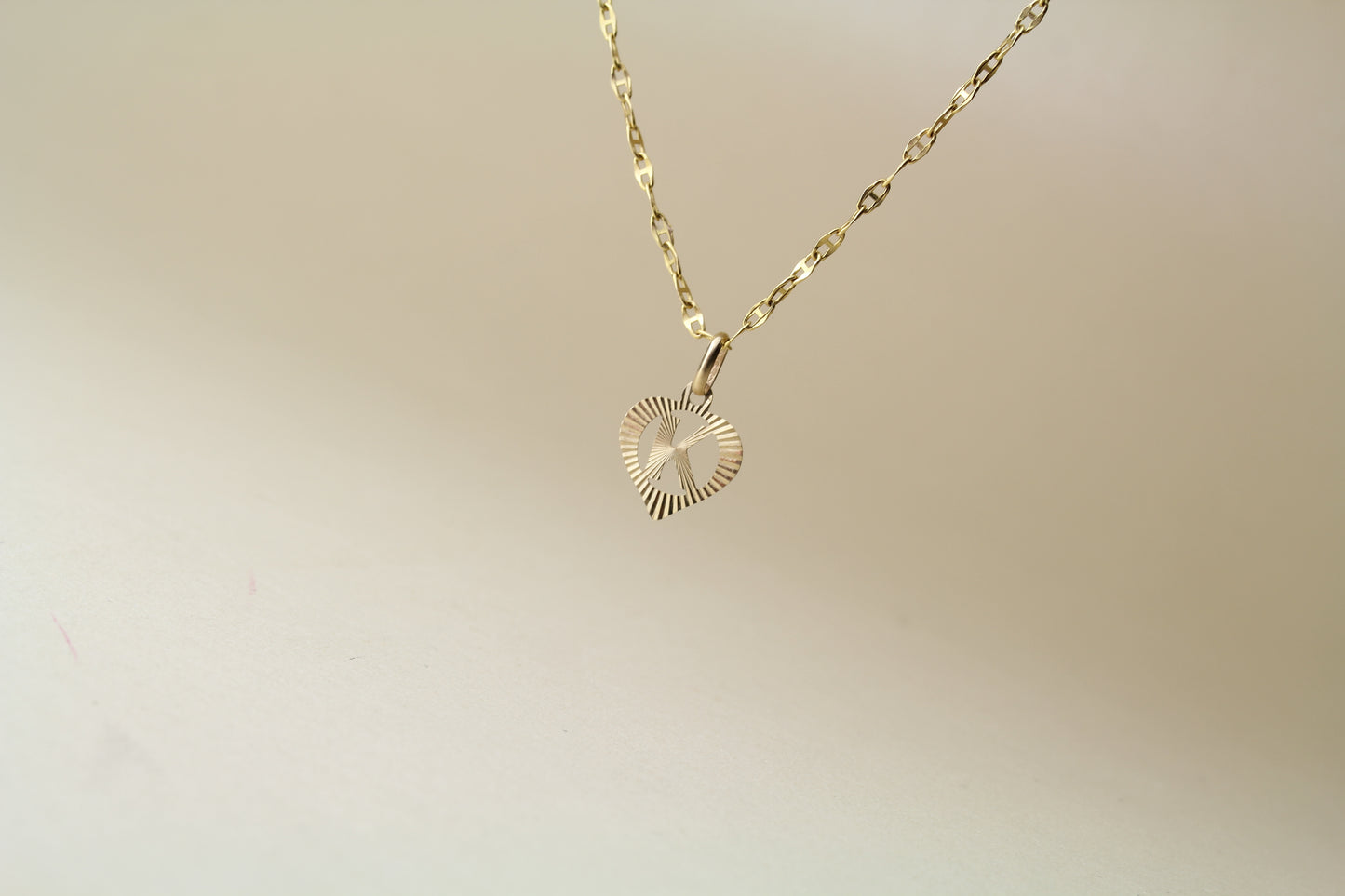 9k Yellow Gold Pendant – Letter "K" in a Heart – Reflective Finish