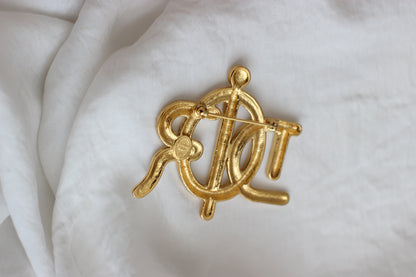 Broche symbole tressée en corde de bateau Dior des années 1980