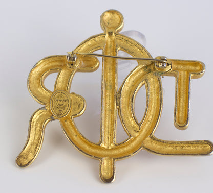 Broche symbole tressée en corde de bateau Dior des années 1980